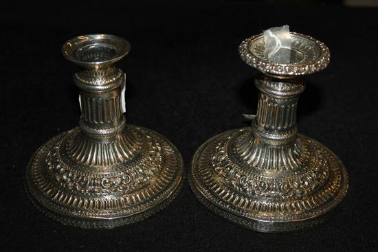 A pair George IV silver dwarf candlesticks by John & Thomas Settle, weighted.